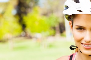 Young Woman Wearing Cycling Helmet At Park.