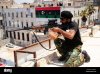 a-nla-sniper-on-the-rooftop-overlooking-the-square-in-benghazi-during-D69RH1.jpg